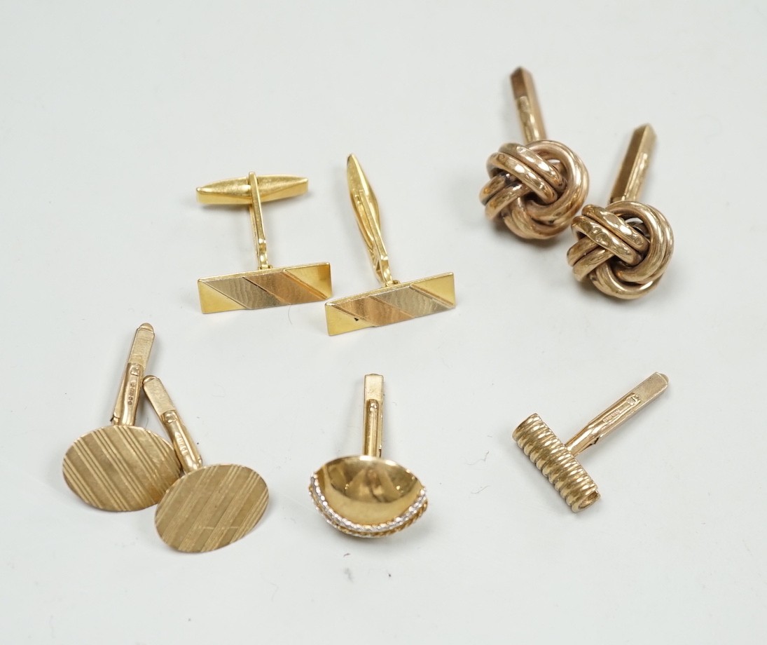 A modern three colour 750 pair of cufflinks, 9.2 grams, a pair of 9ct gold oval cufflinks one other 9ct gold pair and two odd 9ct gold cufflinks, 20.7 grams.